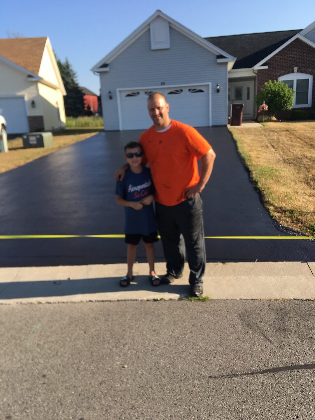 Curved residential driveway after sealcoating