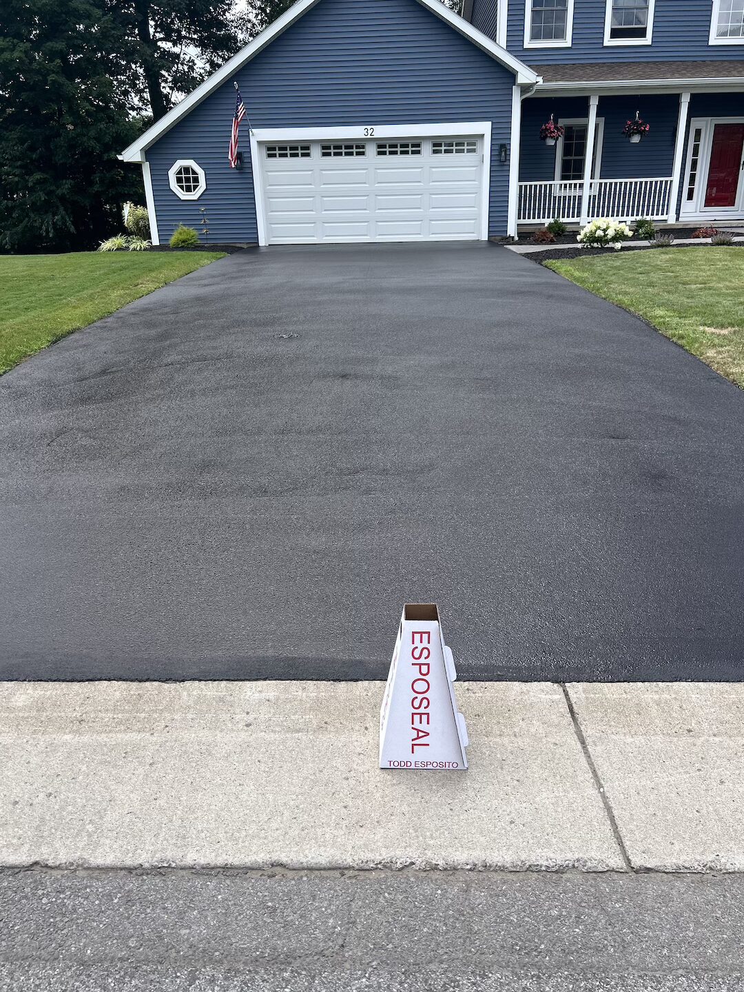 Sealed driveway with deep black finish and clean edges